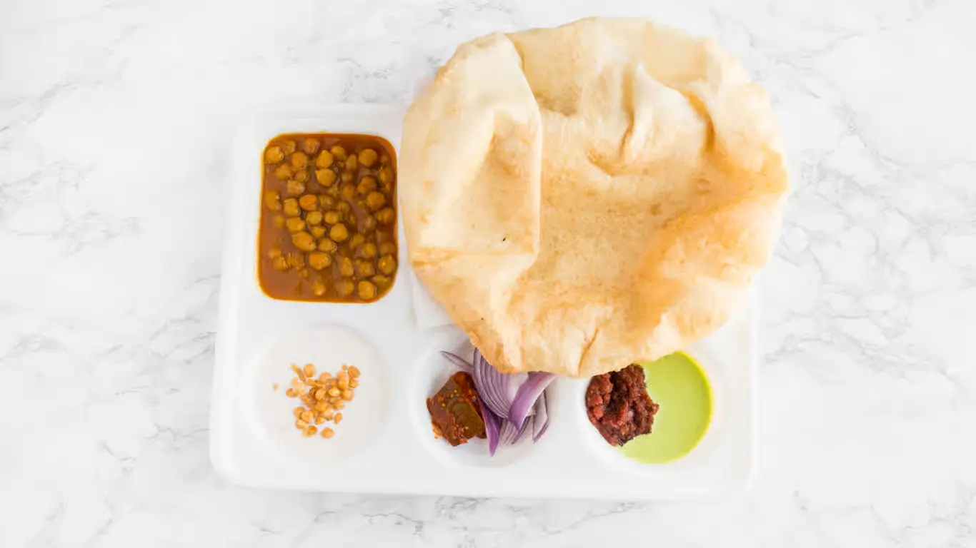 Apna Spicy Hut bhatura chana plate Winnipeg fluffy bread with chickpeas